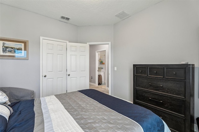 bedroom with carpet floors, a textured ceiling, and a closet