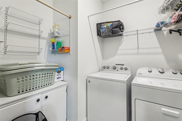 washroom featuring washer and dryer