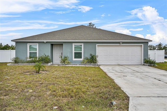 ranch-style home with a garage and a front lawn