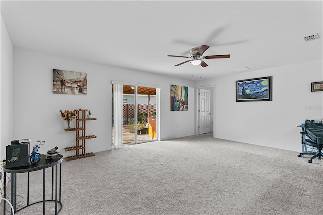 interior space featuring carpet flooring and ceiling fan