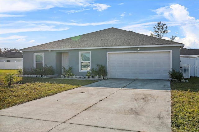 ranch-style house with a front yard and a garage