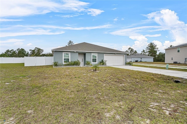 ranch-style home with a front yard and a garage