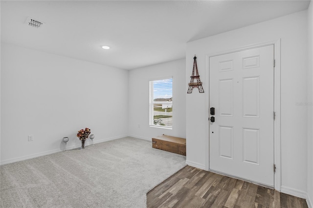 foyer entrance featuring dark wood-type flooring