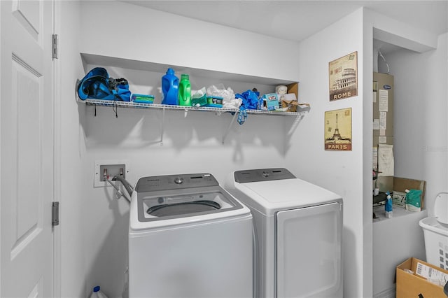 laundry room with independent washer and dryer