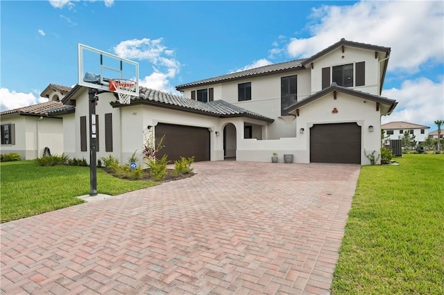 mediterranean / spanish-style house featuring a front yard and central air condition unit