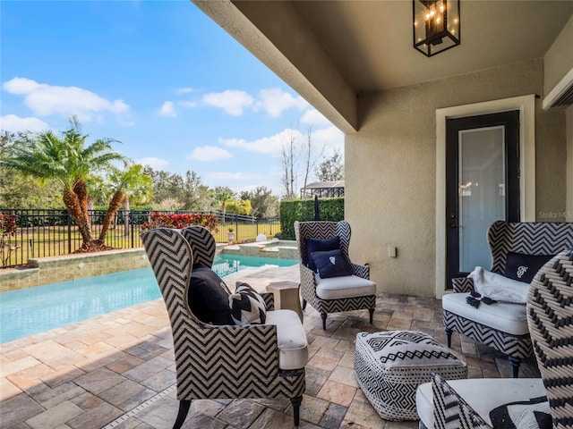 view of patio with a fenced in pool