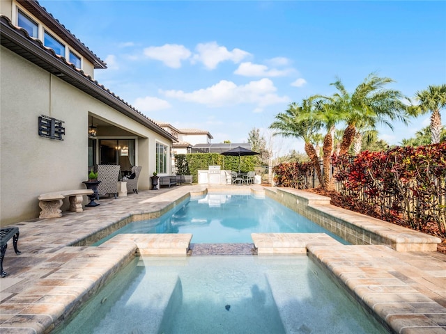 view of pool featuring a patio