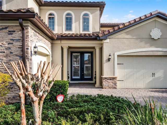 view of exterior entry featuring french doors