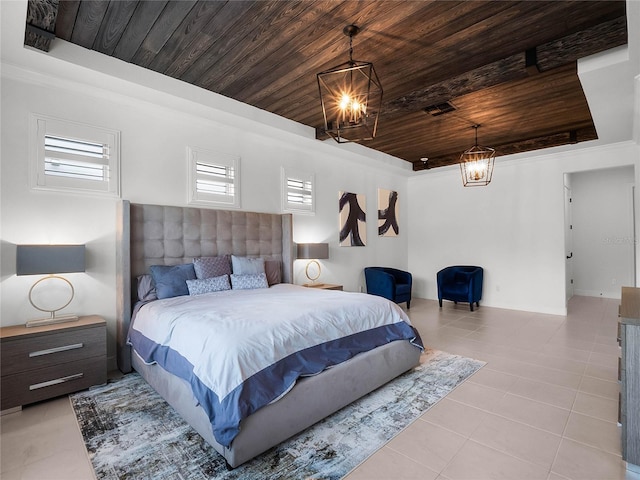 bedroom featuring a raised ceiling, light tile patterned flooring, a notable chandelier, and wood ceiling