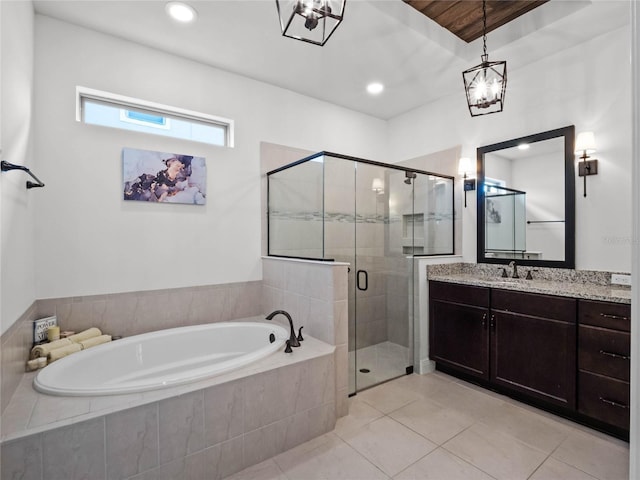 bathroom with vanity, independent shower and bath, and tile patterned flooring