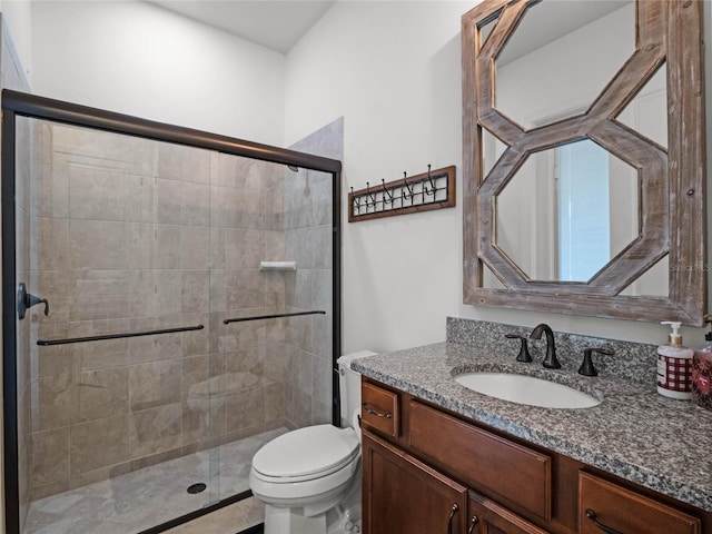 bathroom with vanity, toilet, and walk in shower