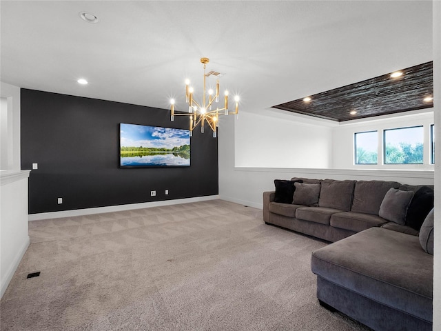 living room featuring a chandelier and light carpet