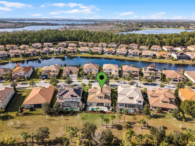 birds eye view of property with a water view