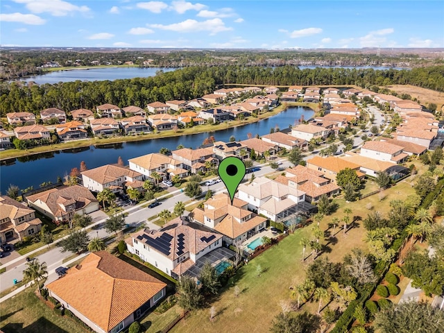 birds eye view of property featuring a water view