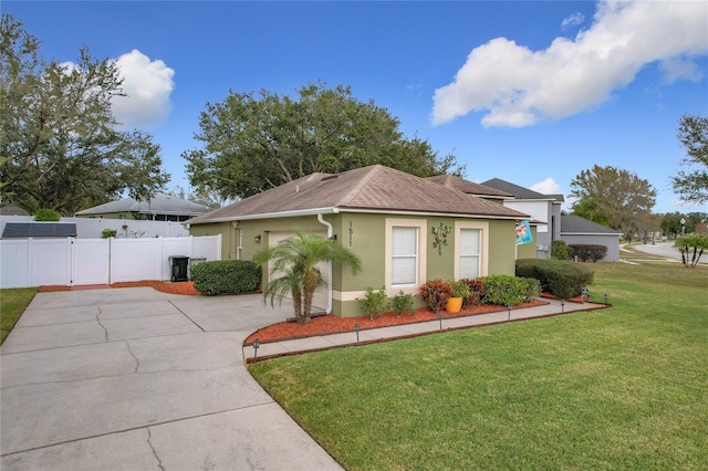 ranch-style home featuring a front lawn and central air condition unit