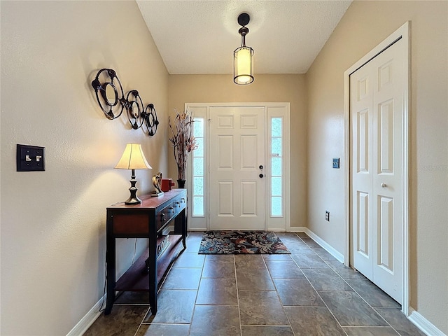 foyer featuring a textured ceiling