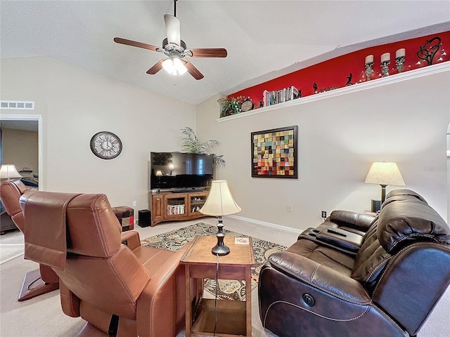 living room with a textured ceiling, ceiling fan, carpet flooring, and lofted ceiling