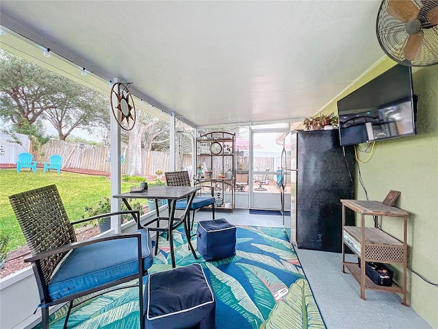 sunroom with ceiling fan and a wealth of natural light