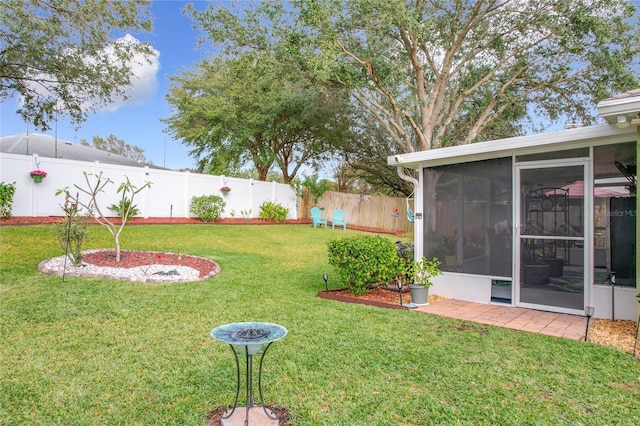 view of yard with a sunroom