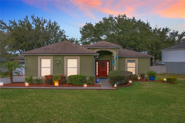 view of front of home with a yard