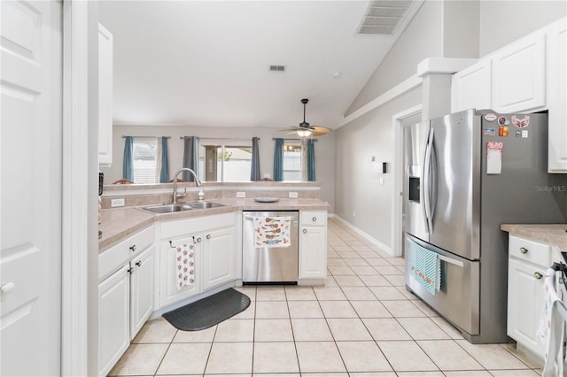 kitchen featuring ceiling fan, sink, white cabinetry, and stainless steel appliances