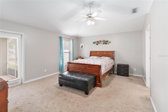 bedroom with ceiling fan and light carpet