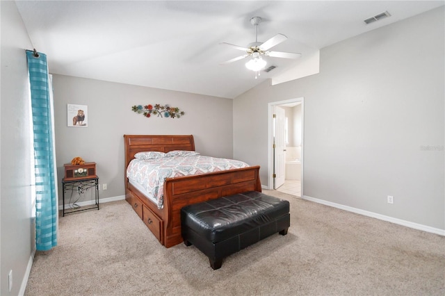 carpeted bedroom with connected bathroom, ceiling fan, and vaulted ceiling