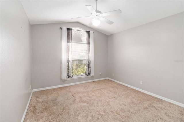 unfurnished room featuring light carpet, ceiling fan, and lofted ceiling