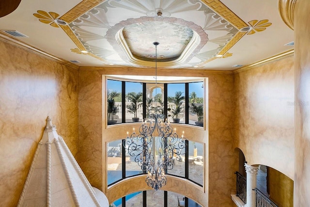 dining area featuring crown molding, arched walkways, visible vents, and a notable chandelier