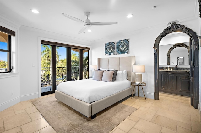 bedroom with access to exterior, stone tile floors, baseboards, and crown molding