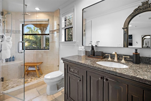 full bathroom with visible vents, toilet, ornamental molding, a shower stall, and vanity