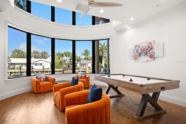 recreation room featuring ceiling fan, baseboards, wood finished floors, and recessed lighting