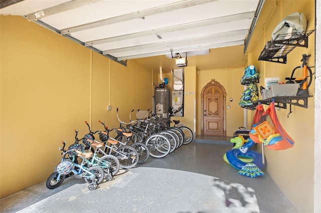 garage featuring a garage door opener and water heater