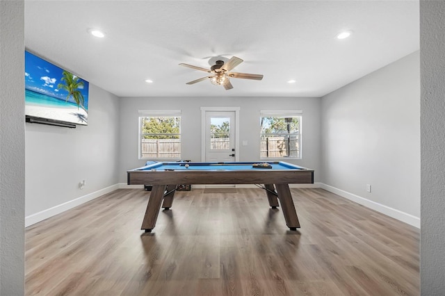 game room with light wood-type flooring, plenty of natural light, ceiling fan, and billiards