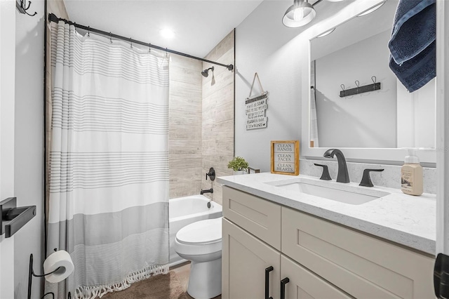 full bathroom featuring shower / bath combo, vanity, and toilet