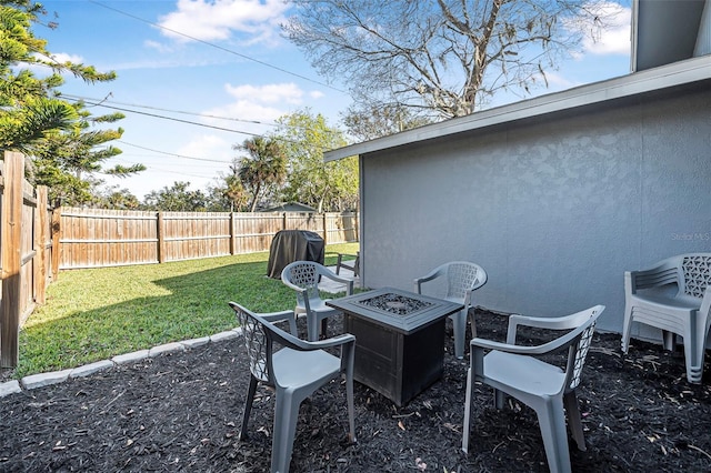 view of patio / terrace with a fire pit