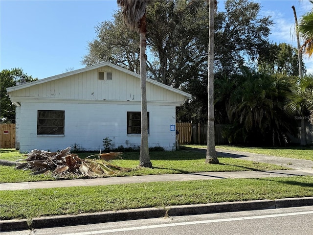 view of home's exterior with a yard