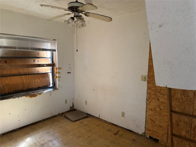 spare room featuring ceiling fan