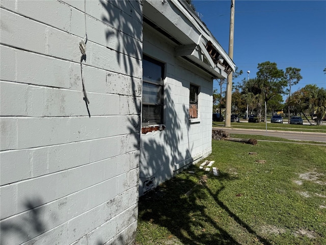 view of home's exterior with a lawn