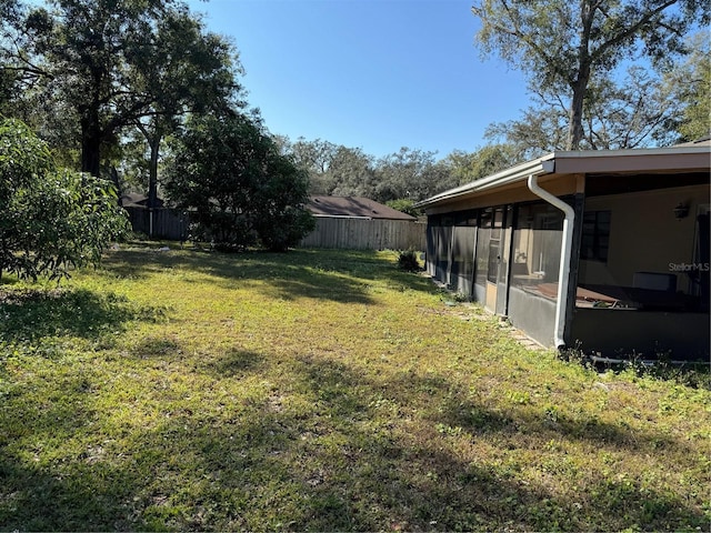 view of yard featuring a sunroom