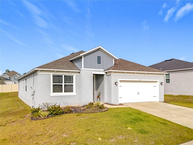 view of front of property with a garage and a front yard