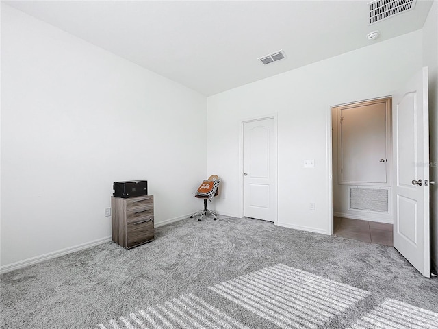 unfurnished bedroom featuring light carpet