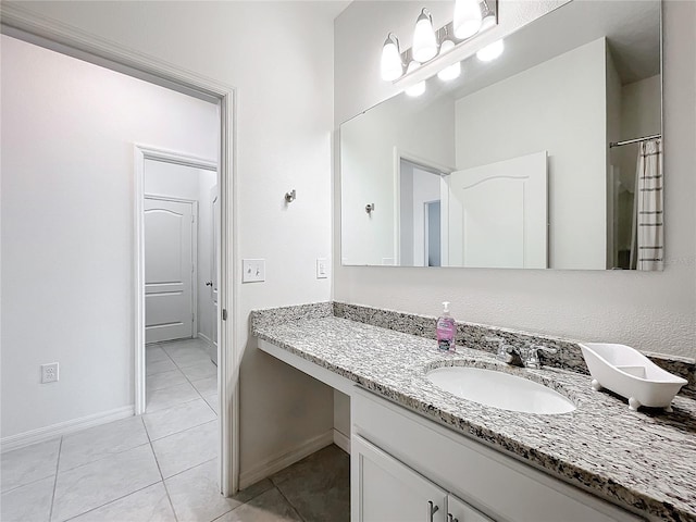 bathroom featuring tile patterned floors and vanity