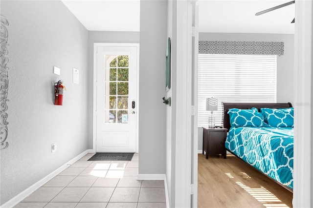 unfurnished bedroom featuring ceiling fan and light tile patterned floors