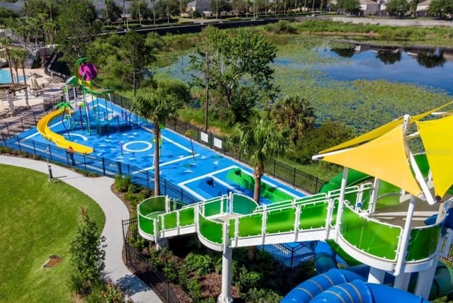 birds eye view of property with a water view