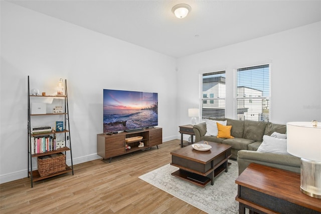 living room with light hardwood / wood-style flooring