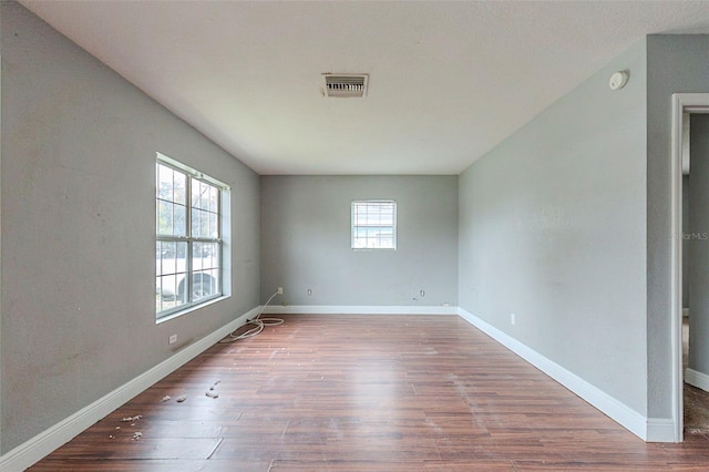 empty room with hardwood / wood-style floors