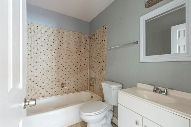 full bathroom featuring tiled shower / bath combo, vanity, and toilet