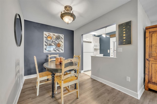 dining space featuring hardwood / wood-style floors