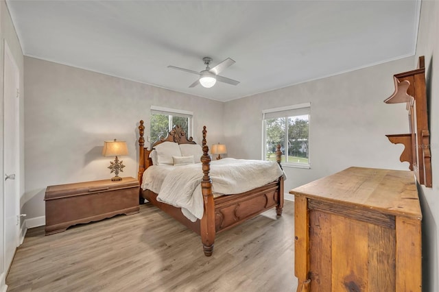 bedroom featuring ceiling fan and light hardwood / wood-style floors